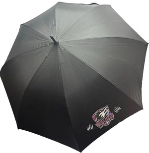 A black open umbrella with a wolf logo and the text 'WOLVES' printed near the lower right, photographed indoors against a white wall and shelving.