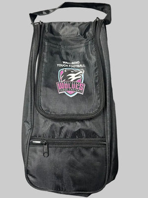 A black textured nylon boot bag with a top handle, featuring a front zippered pocket with a 'Wildcats' logo and a side zippered pocket, shown on a gray textured surface.