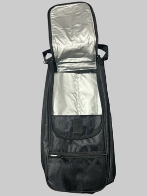 A black soft-sided instrument case or bag shown open from above on a gray textured surface, with a silver reflective interior lining and a front zip pocket.