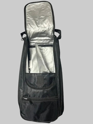 A black instrument gig bag with a silver interior lining, shown open and laid flat on a gray carpeted floor.